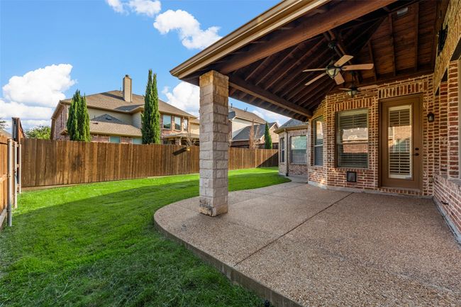 View of patio / terrace with a ceiling fan | Image 7