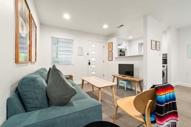 Living area with washer / clothes dryer and recessed lighting | Image 5