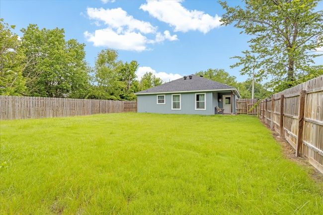 Rear view of property with a fenced backyard | Image 18