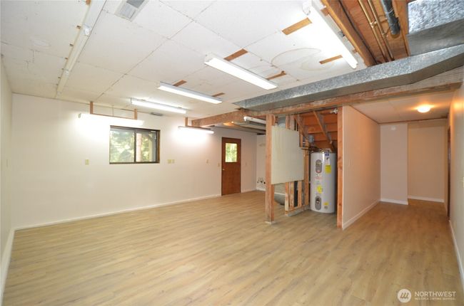 Downstairs...a wall could be put down the middle to build 2 extra bedrooms. Potential for MIL with Separate Flat Entrance. | Image 29