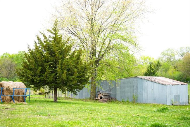 View of yard featuring an outbuilding and an outdoor structure | Image 29