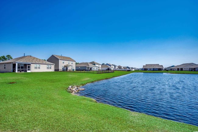 Property view of water with a residential view and fence | Image 8