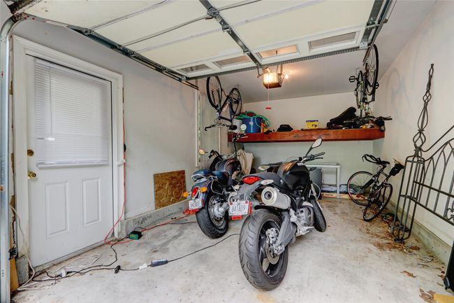 Garage with a garage door opener | Image 30