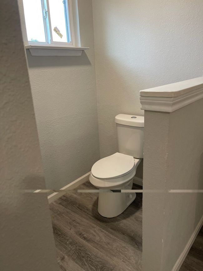 Bathroom with toilet and hardwood / wood-style floors | Image 8