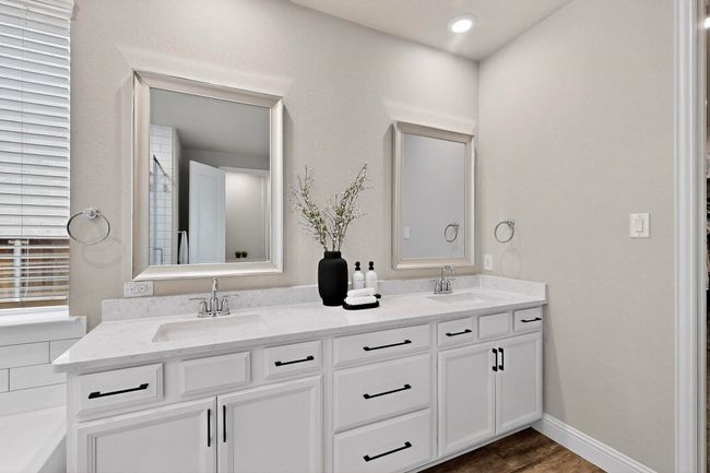 Full bathroom with double vanity and dark wood-style floors | Image 18