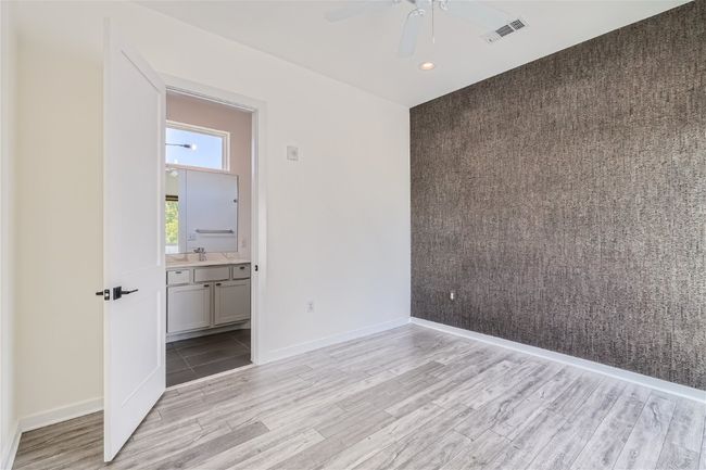 The primary suite is located on the upper level with direct access to the balcony and a gorgeous ensuite bath. | Image 28