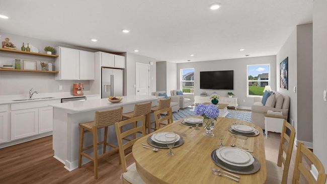 The spacious living room flows seamlessly to the dining and kitchen. Photo of actual home! | Image 5