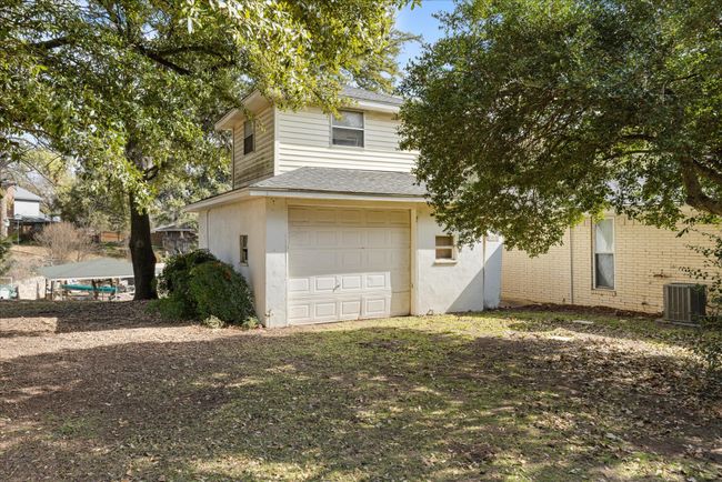 Extra single car garage for added storage. Loft upstairs. | Image 32