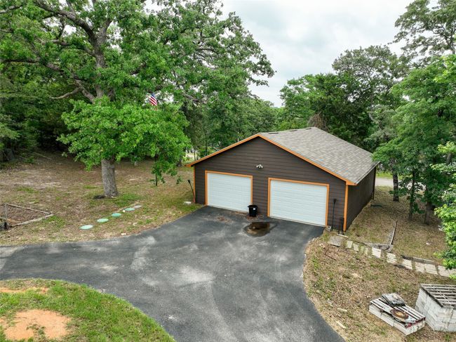 Detached garage featuring driveway | Image 6