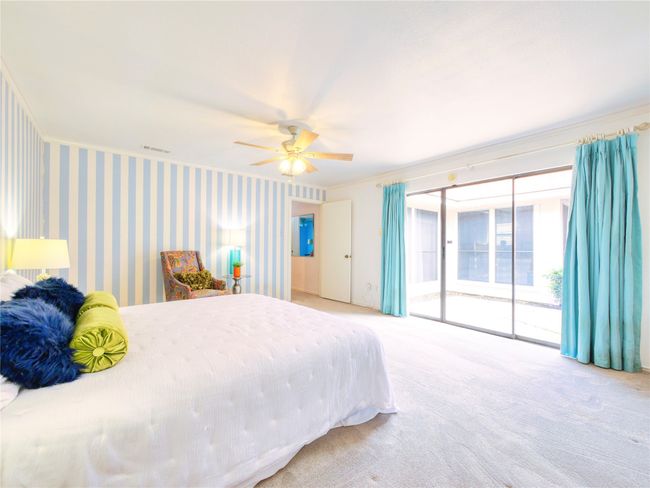 Bedroom with access to outside, carpet flooring, and a ceiling fan | Image 18