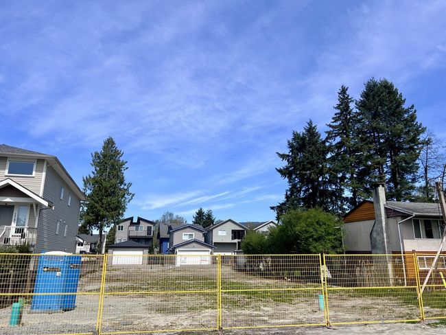 View of yard with fence and a residential view | Image 6