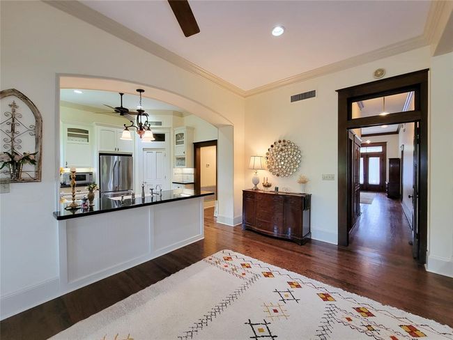 Step into the expansive 33 ft. wide living room, beautifully anchored by the oversized hallway. | Image 12