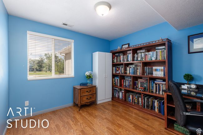 Office space featuring wood finished floors and baseboards | Image 20