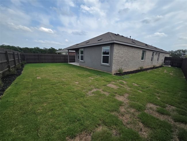 View of fenced backyard | Image 27