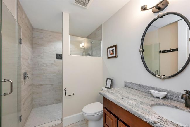 Bathroom featuring vanity and a stall shower | Image 55