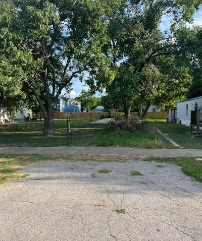 Front view of property, with driveway leading to property. | Image 2