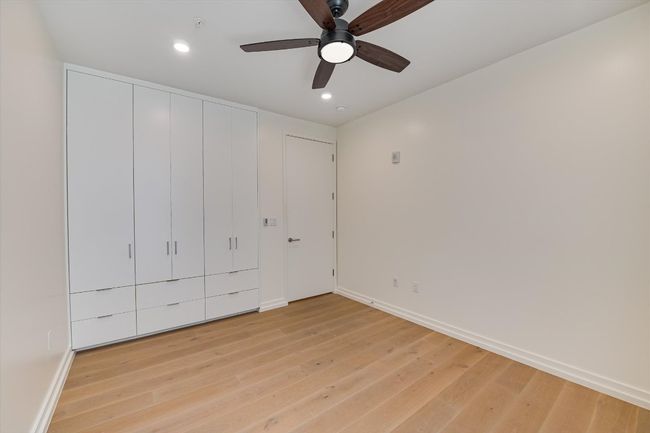 Bedroom 2 featuring build in storage | Image 12