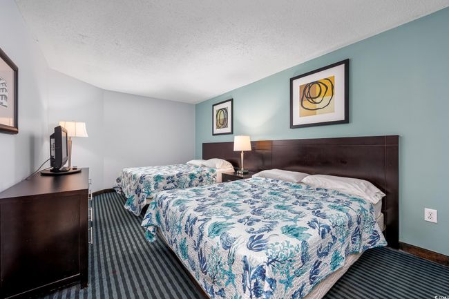 Carpeted bedroom with baseboards and a textured ceiling | Image 17