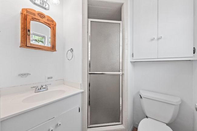 Bathroom with vanity, a shower stall, and toilet | Image 18