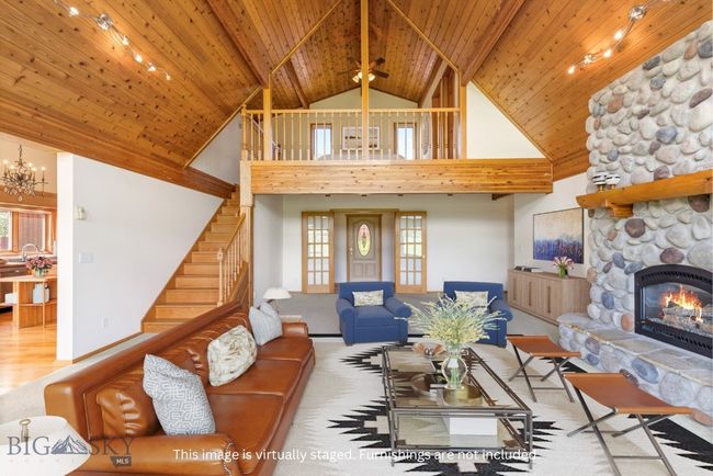 Living area. This image has been virtually staged. | Image 11