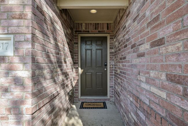 Property entrance with brick siding | Image 5