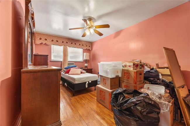 Bedroom featuring light wood-style floors and a ceiling fan | Image 20