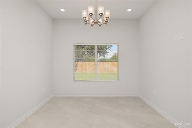 Unfurnished room featuring a chandelier and recessed lighting | Image 6