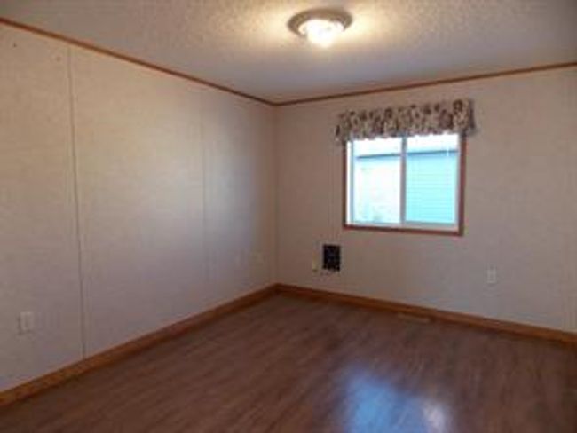 77 - 5210 65 Ave, Home with 3 bedrooms, 2 bathrooms and 3 parking in Olds AB | Image 31