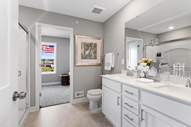(Photo of a decorated model, actual homes finishes will vary) Another view of the spacious owner's bath. | Image 12