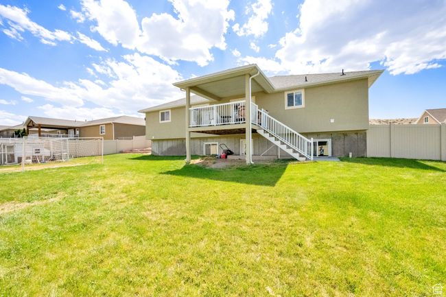 Back of property featuring stairs and a deck | Image 24