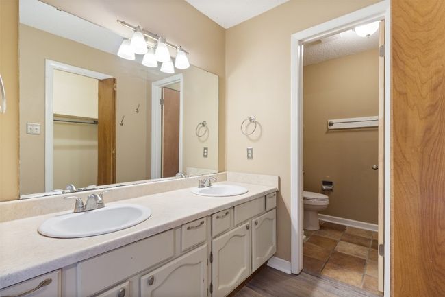 Primary bath has double vanity, walk-in closet and storage | Image 10