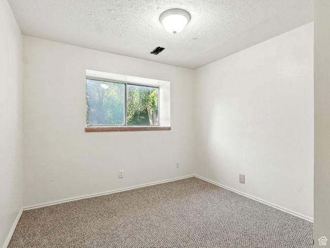 Carpeted empty room with baseboards and a textured ceiling | Image 14