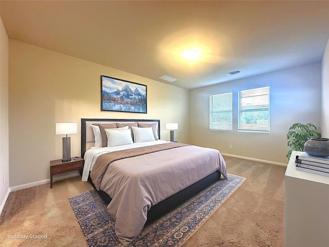 Bedroom with baseboards and light colored carpet | Image 9