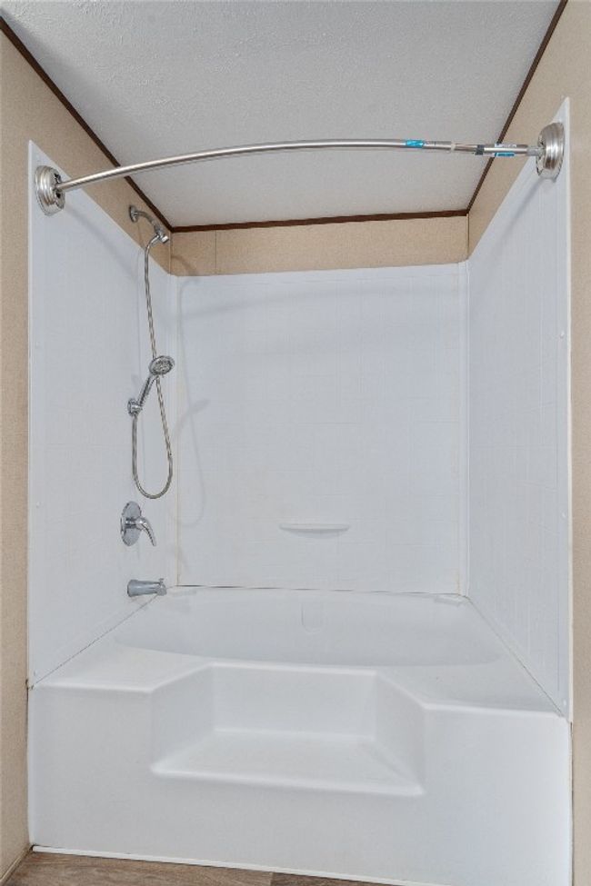 Bathroom featuring bathtub / shower combination | Image 22