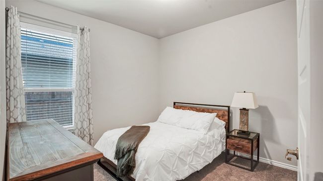 Bedroom featuring baseboards and carpet | Image 22