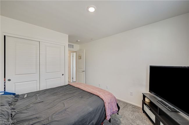 Bedroom featuring carpet and a closet | Image 19
