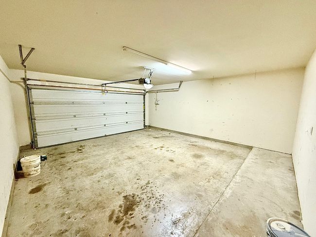 Garage with a garage door opener | Image 22