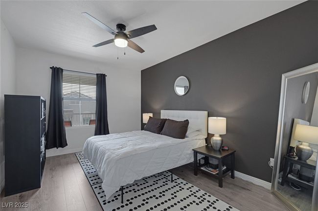Bedroom featuring baseboards, ceiling fan, and wood finished floors | Image 18