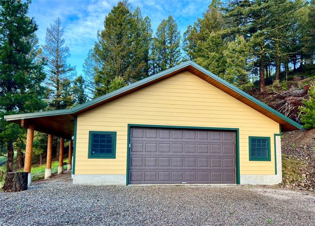 Garage featuring a garage | Image 63