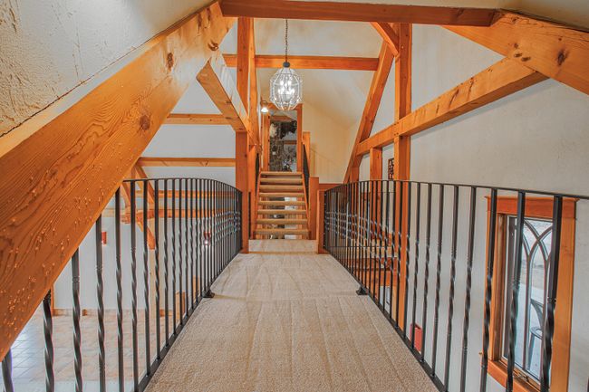Bridge above pool room from office to mezzanine/loft | Image 49