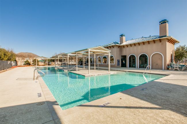 Community pool featuring fence and a patio area | Image 25