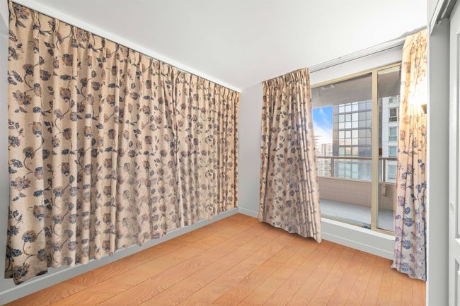 Empty room with baseboards and wood finished floors | Image 8