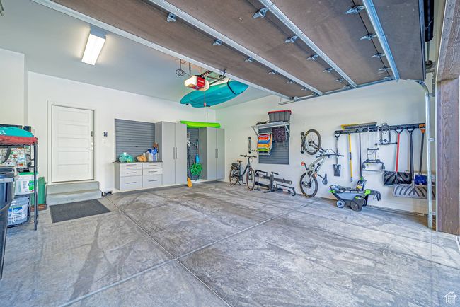 Garage with a garage door opener | Image 30
