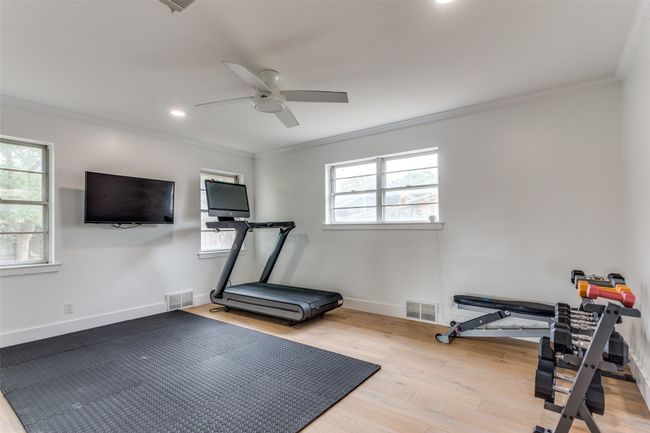 2nd downstairs bedroom is currently used as an exercise room. | Image 17
