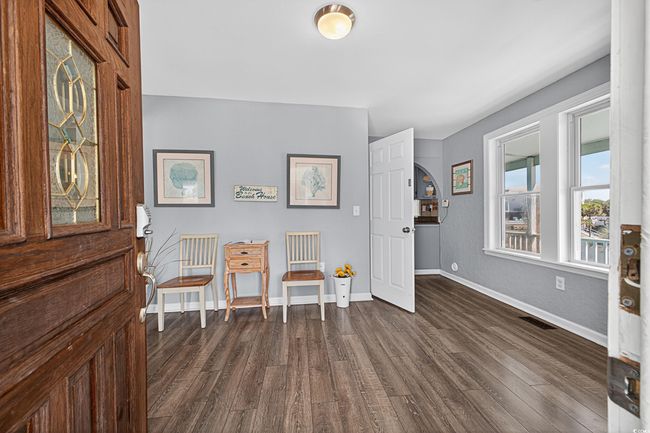 Foyer entrance with dark wood finished floors and baseboards | Image 31