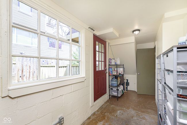 This door is on the side of the house and leads to the river side of the yard, perfect access for storing patio chairs! | Image 22
