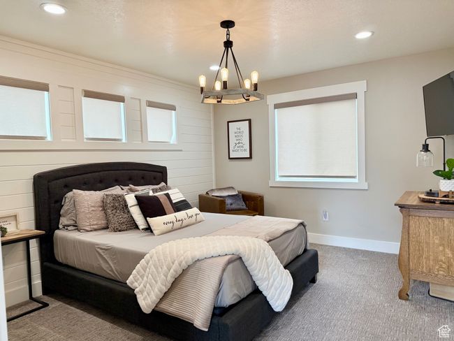 Bedroom with an inviting chandelier, recessed lighting, baseboards, and carpet floors | Image 26