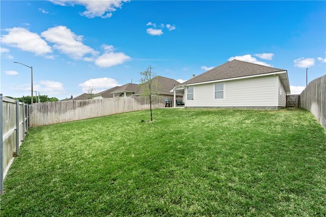 View of yard featuring a fenced backyard | Image 27