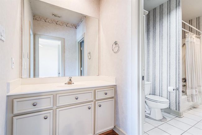 En suite 'Jack and Jill' bathroom shared by the two upper level bedrooms. | Image 37