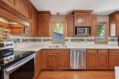 Kitchen with views to the backyard. | Image 3